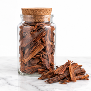 Professional studio product photography of a clear glass jar filled with whole Mexican Mimosa Hostilis inner root bark pieces. The bark is a rich reddish-brown color with a fibrous, stringy texture. The jar has a cork lid and sits on a clean white marble surface. A few loose bark pieces rest beside the jar. Soft, diffused studio lighting from above and sides creates gentle shadows. The background is a seamless pure white. Sharp focus on the jar and bark. Commercial-grade, e-commerce style, minimal and clean aesthetic, hyper-realistic, 8K resolution.